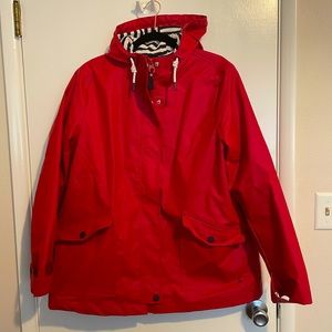 Red women’s raincoat in size 14